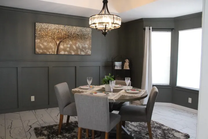 Dining area with wainscoting and crown molding