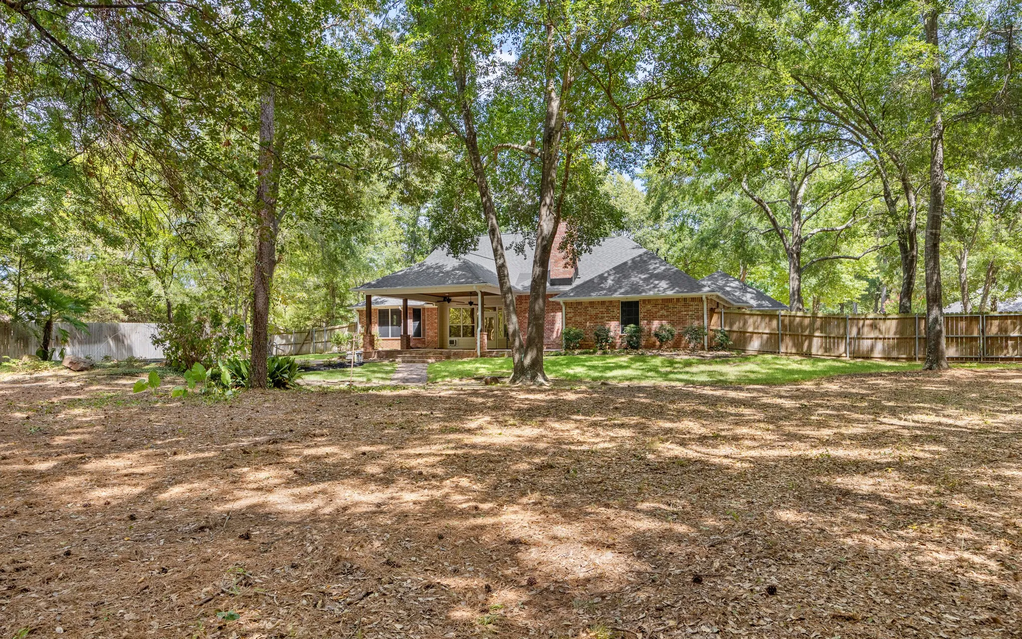 Wooded and toward the house