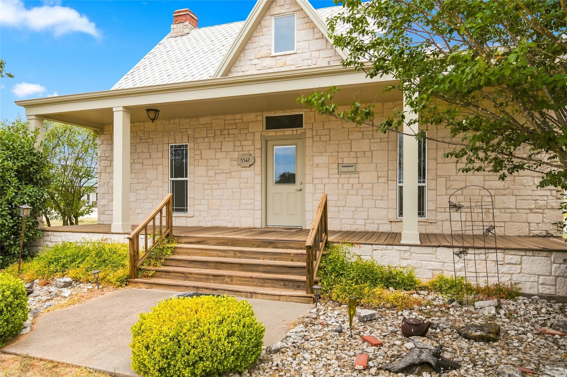 Stone exterior construction with a prominent front porch