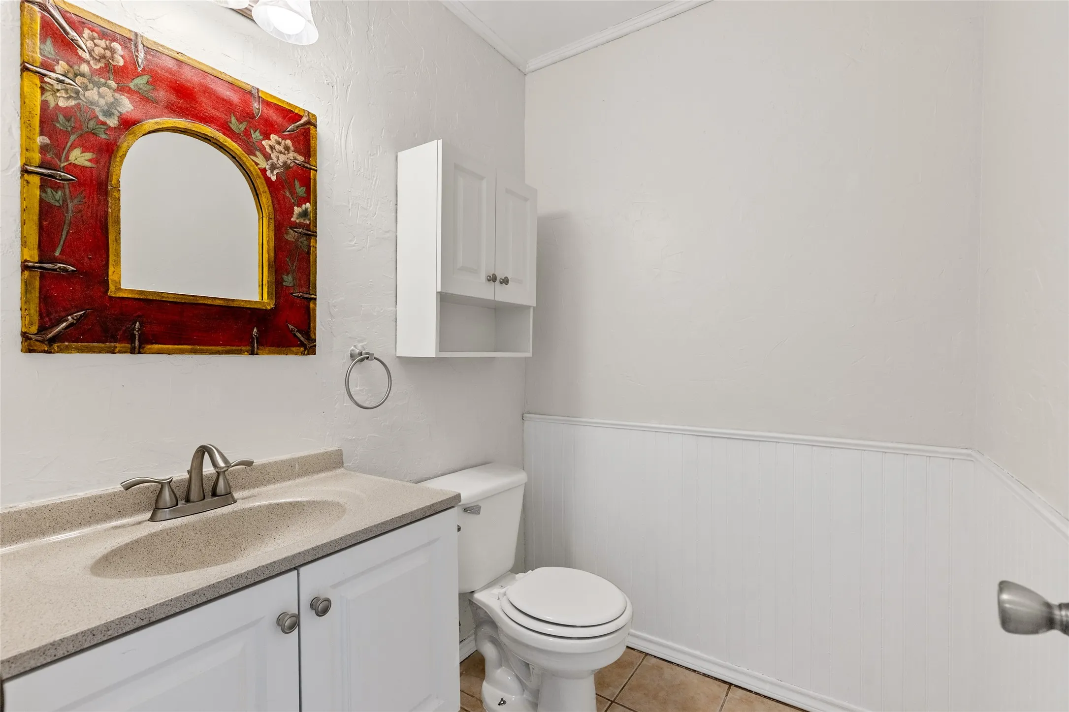 Vanity with an integrated sink and light-colored countertop