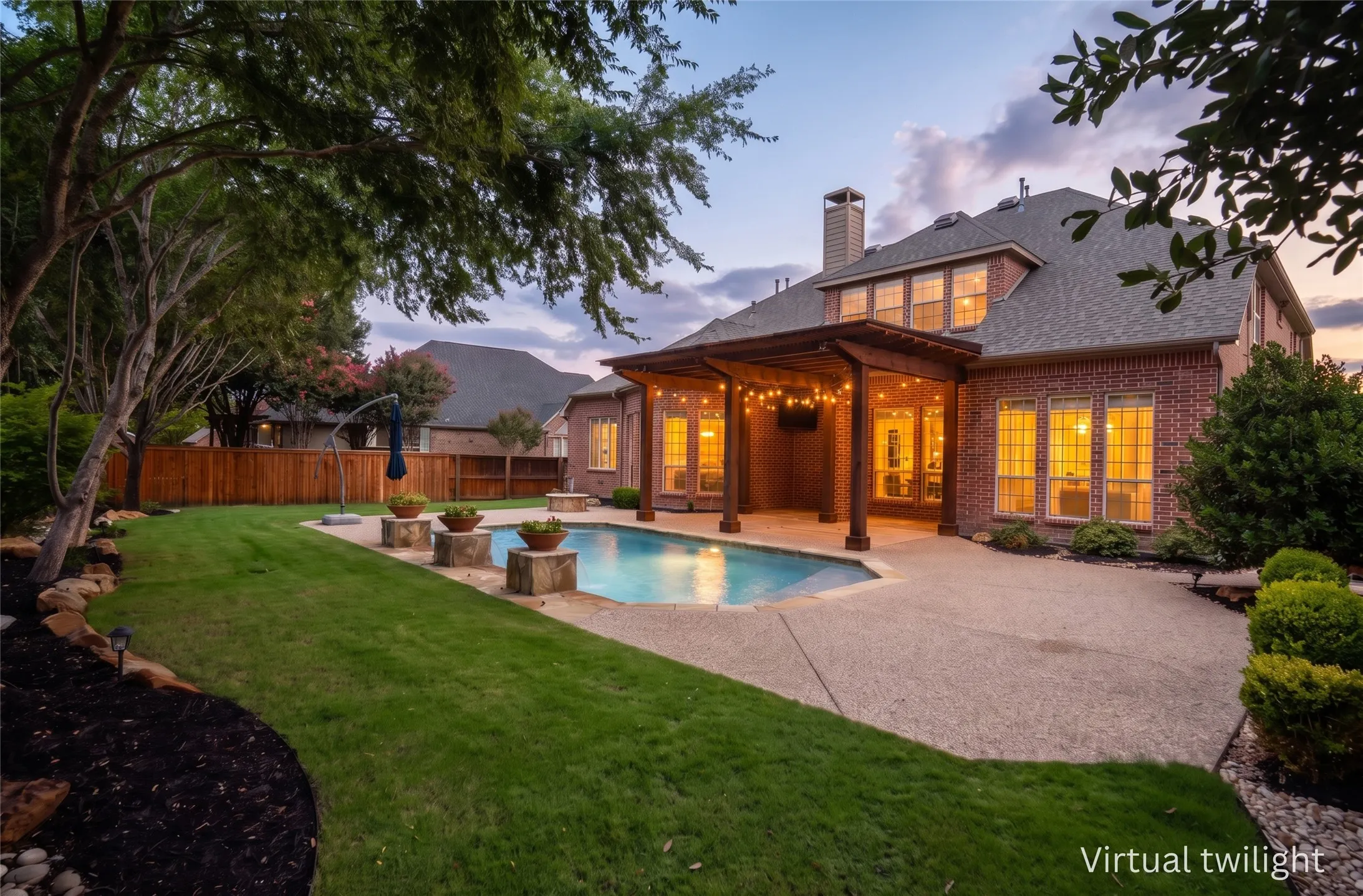 Additional rear exterior view highlighting the private backyard oasis
