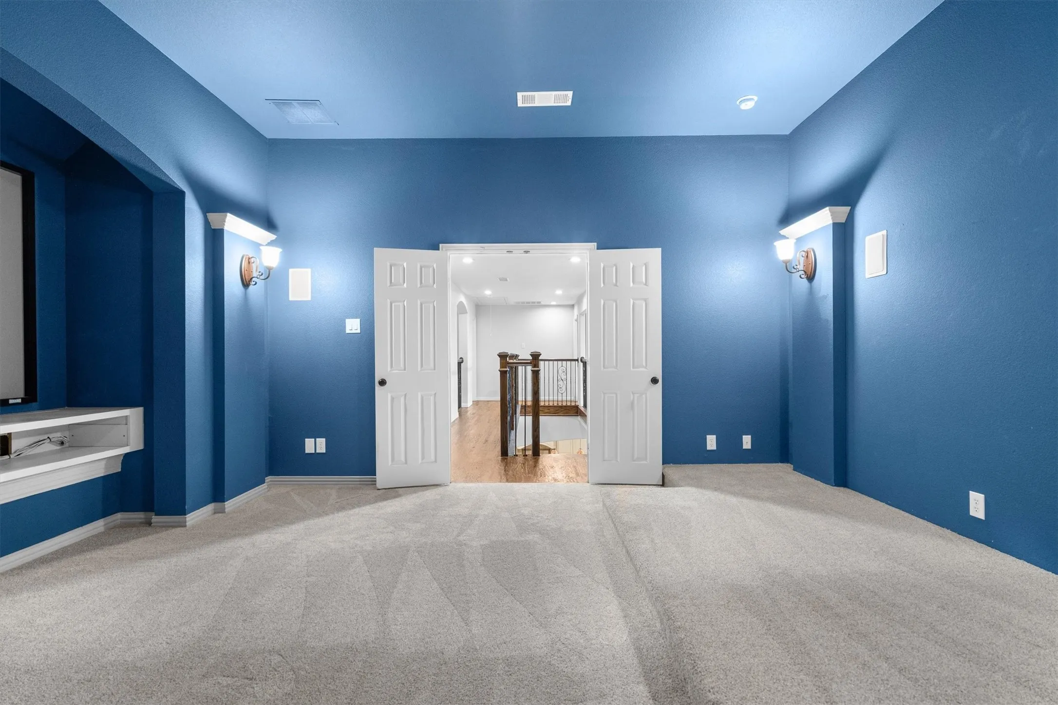 Media room second view showing flexible layout and entry to adjoining space