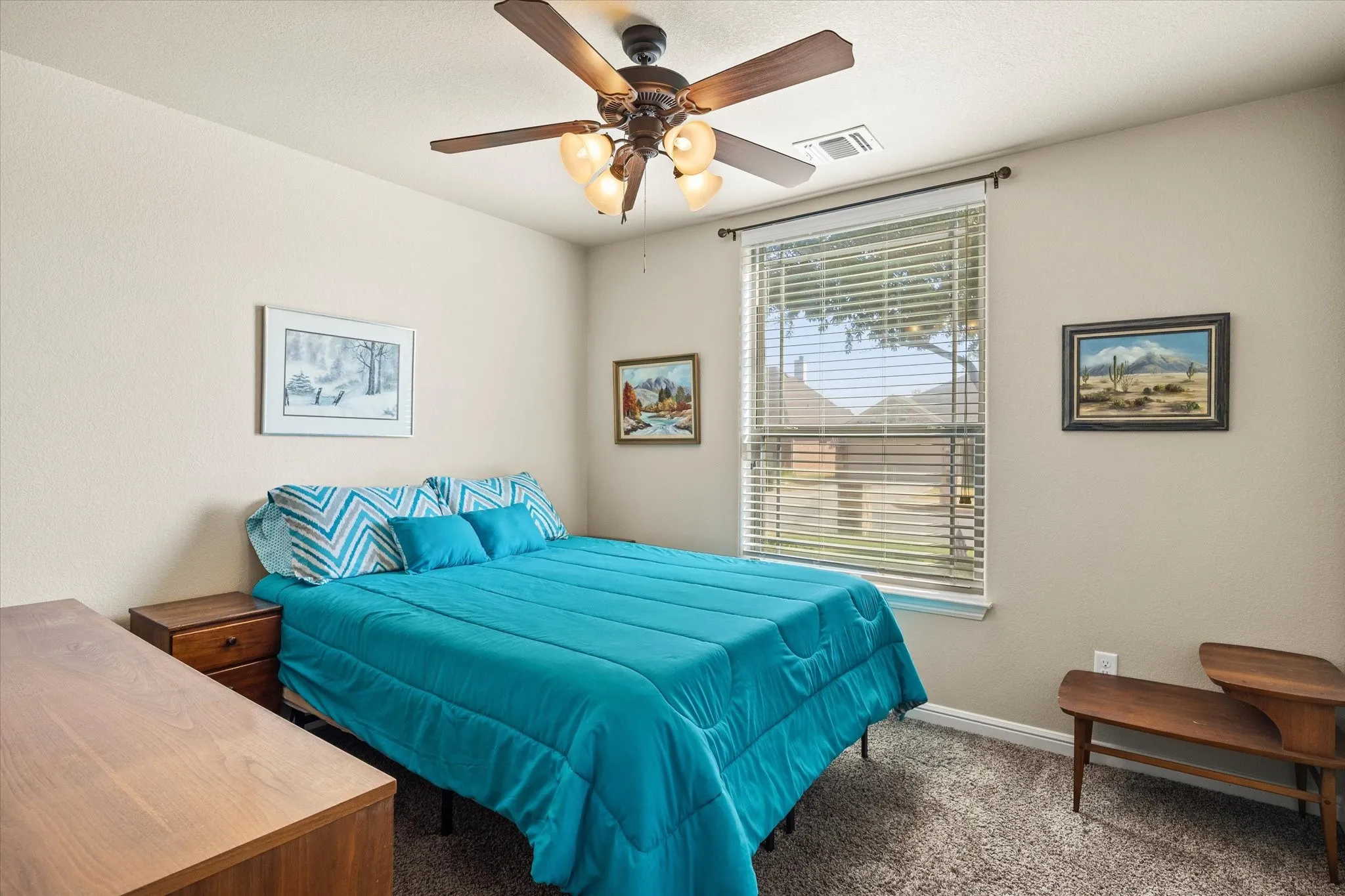 Neutral wall paint, ceiling fan, window with blinds, and carpeted flooring