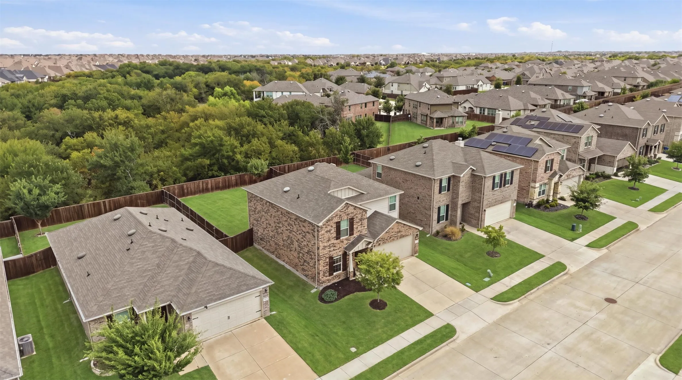 Manicured front lawns and inviting sidewalks create a well-kept neighborhood feel
