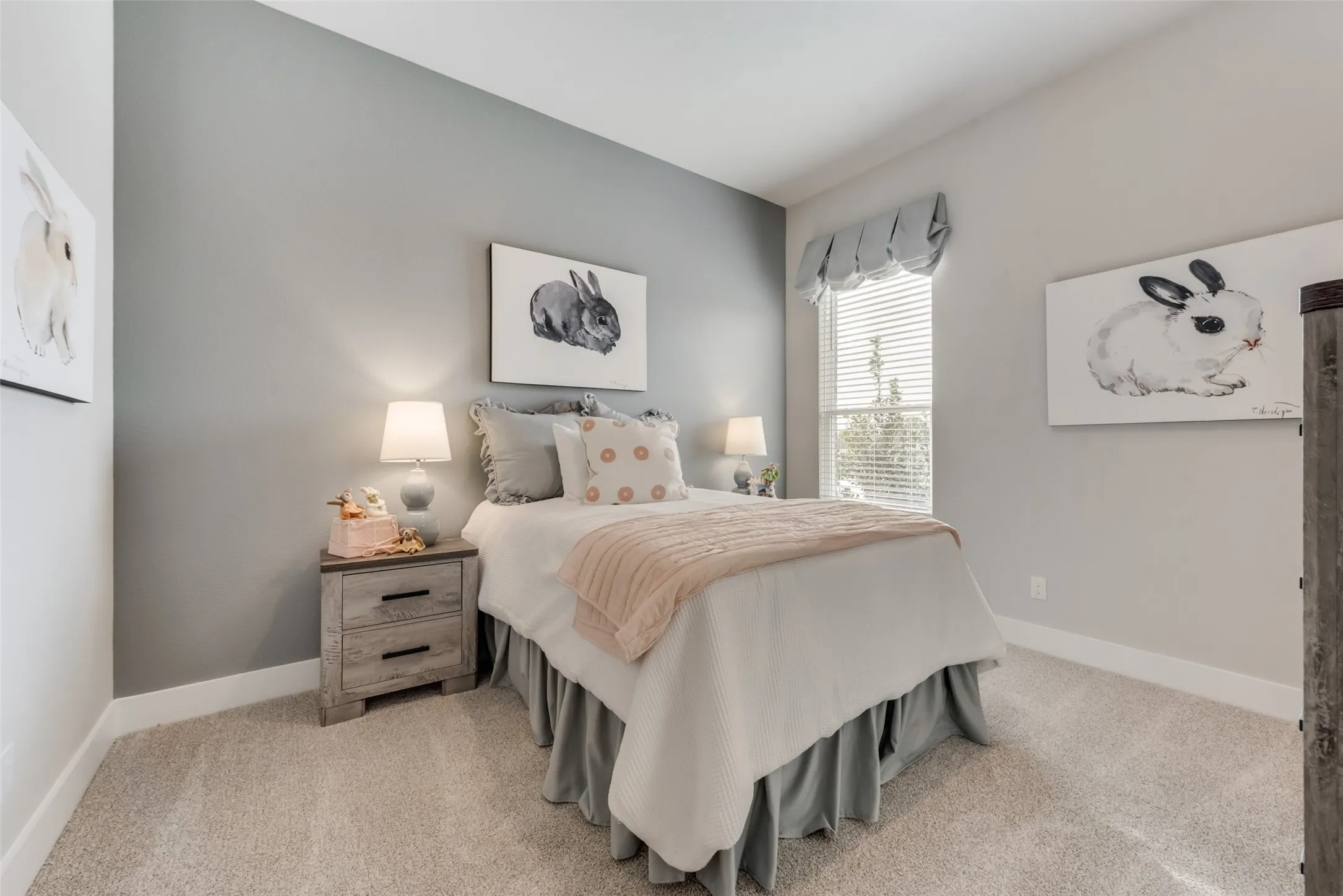 Carpeted bedroom featuring a window with blinds, a contrasting accent wall, and a textured headboard