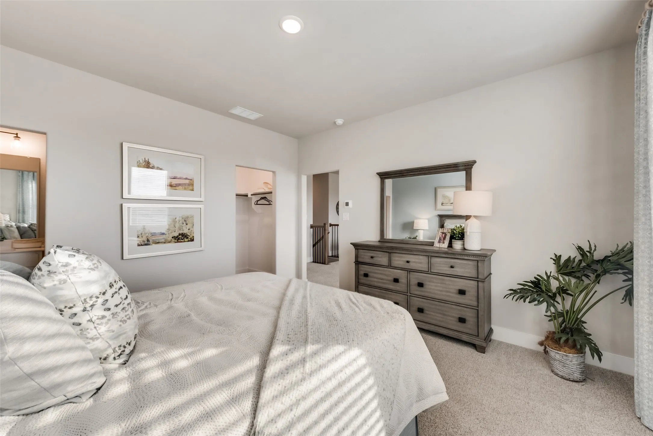 Carpeted flooring, recessed lighting, and a closet with hanging space