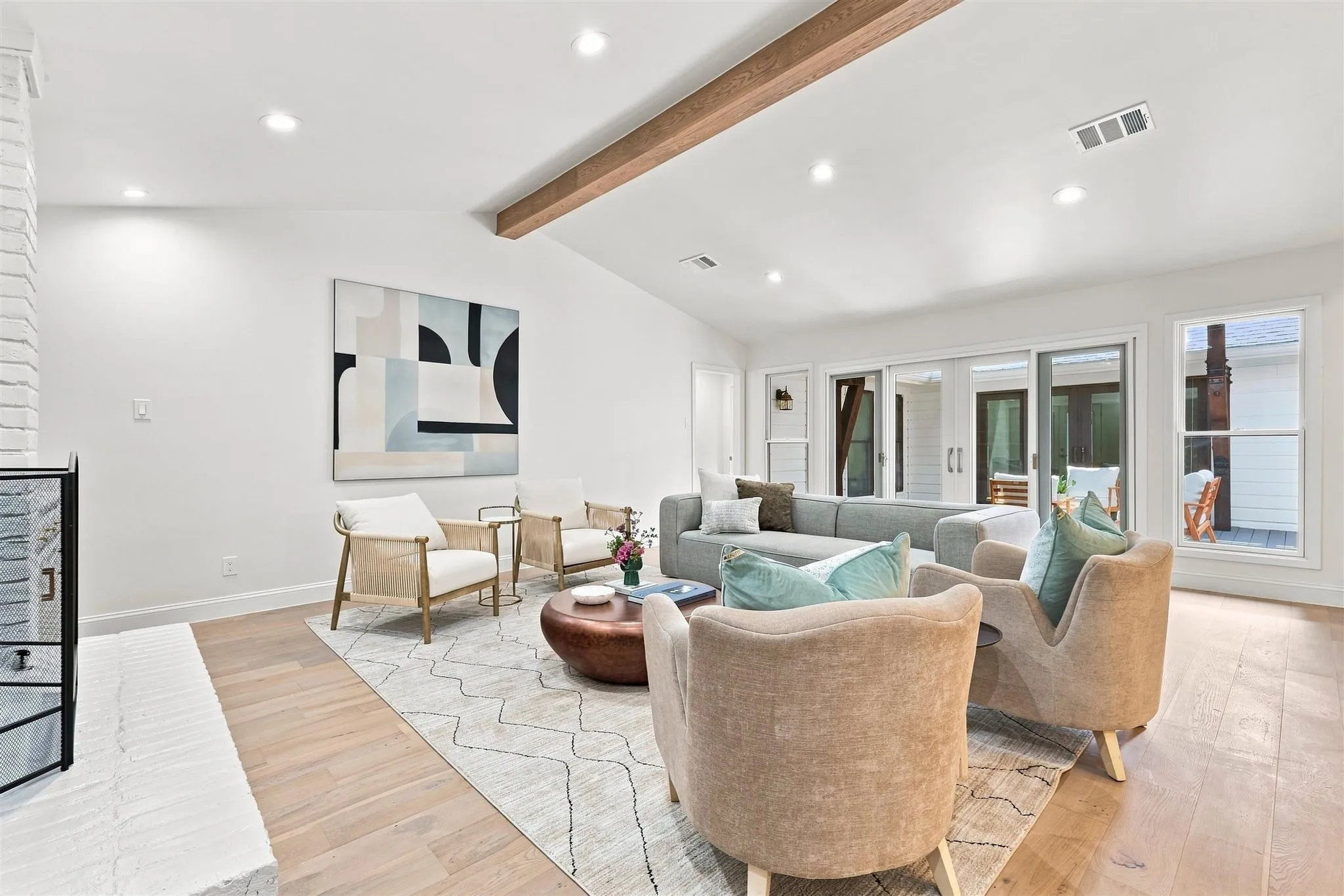 Vaulted ceiling with exposed wood-finish beam