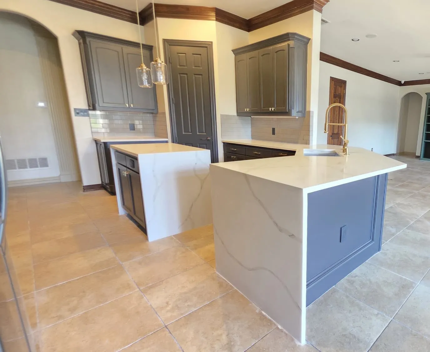 UPDATED KITCHEN WITH QUARTZ WATERFALL COUNTERS.