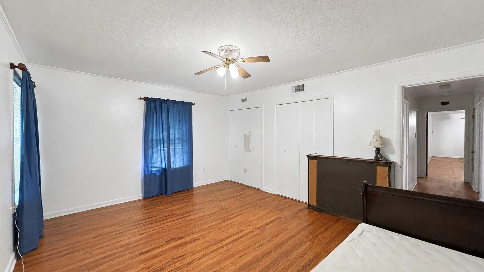 Primary Bedroom with two closets in Red Brick Home.