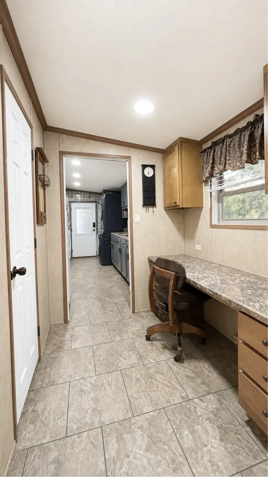 Office Area with Half Bath Between the Kitchen and Laundry Room in Double-Wide Home.