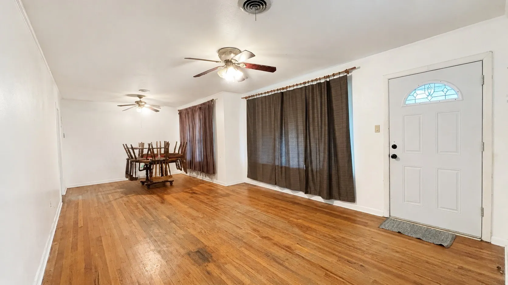 Front Door Entry to First Living Area in Red Brick Home.