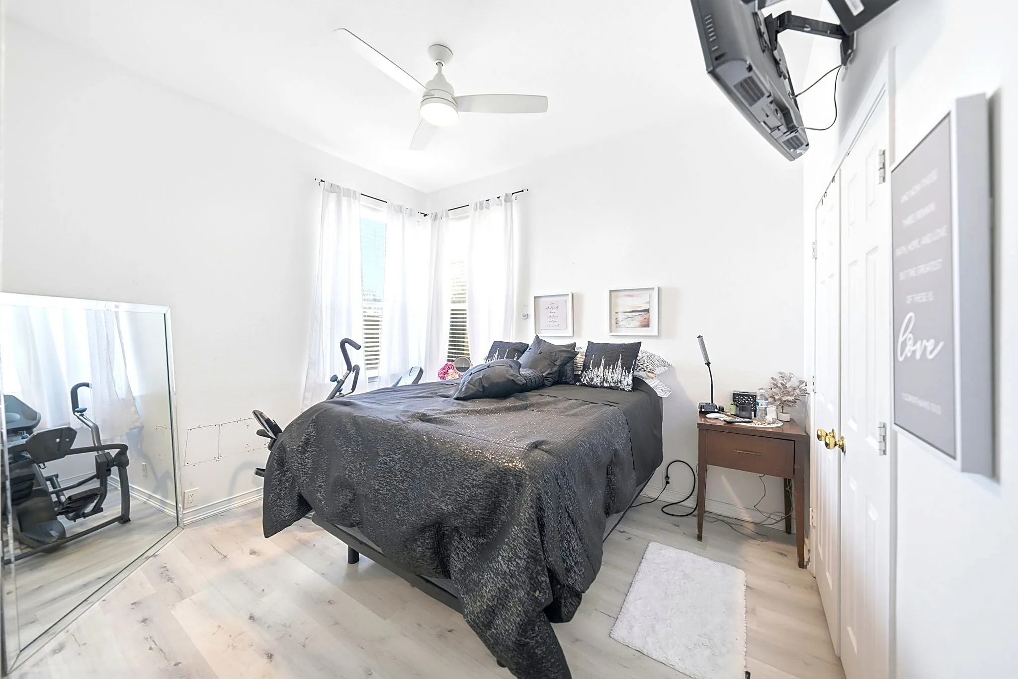 White walls with wood-finish flooring