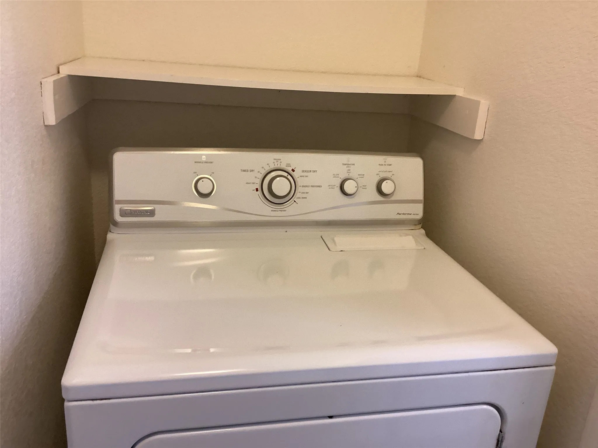 Appliance alcove with a built-in shelf