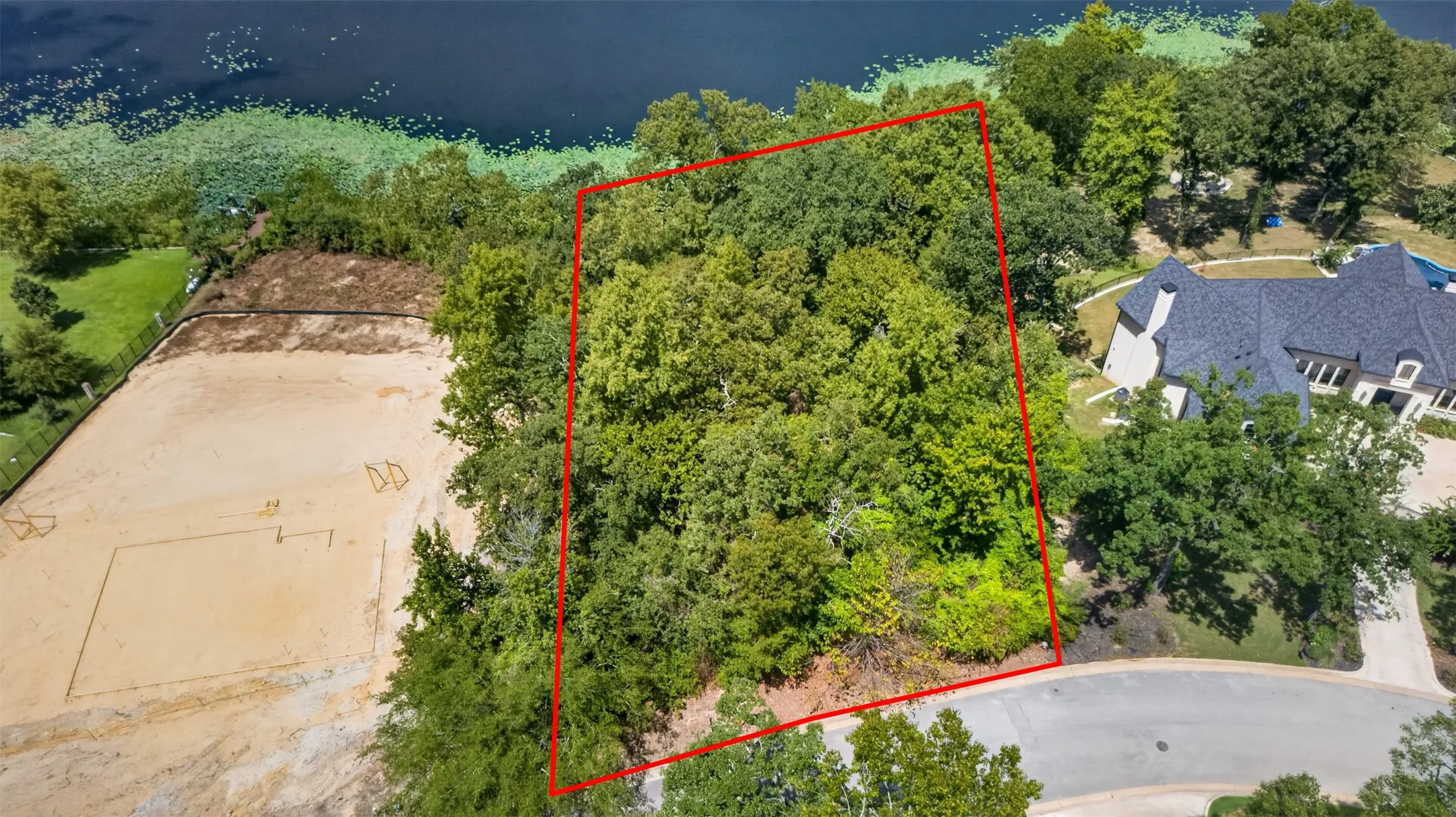 Wooded lot featuring mature trees and waterfront proximity