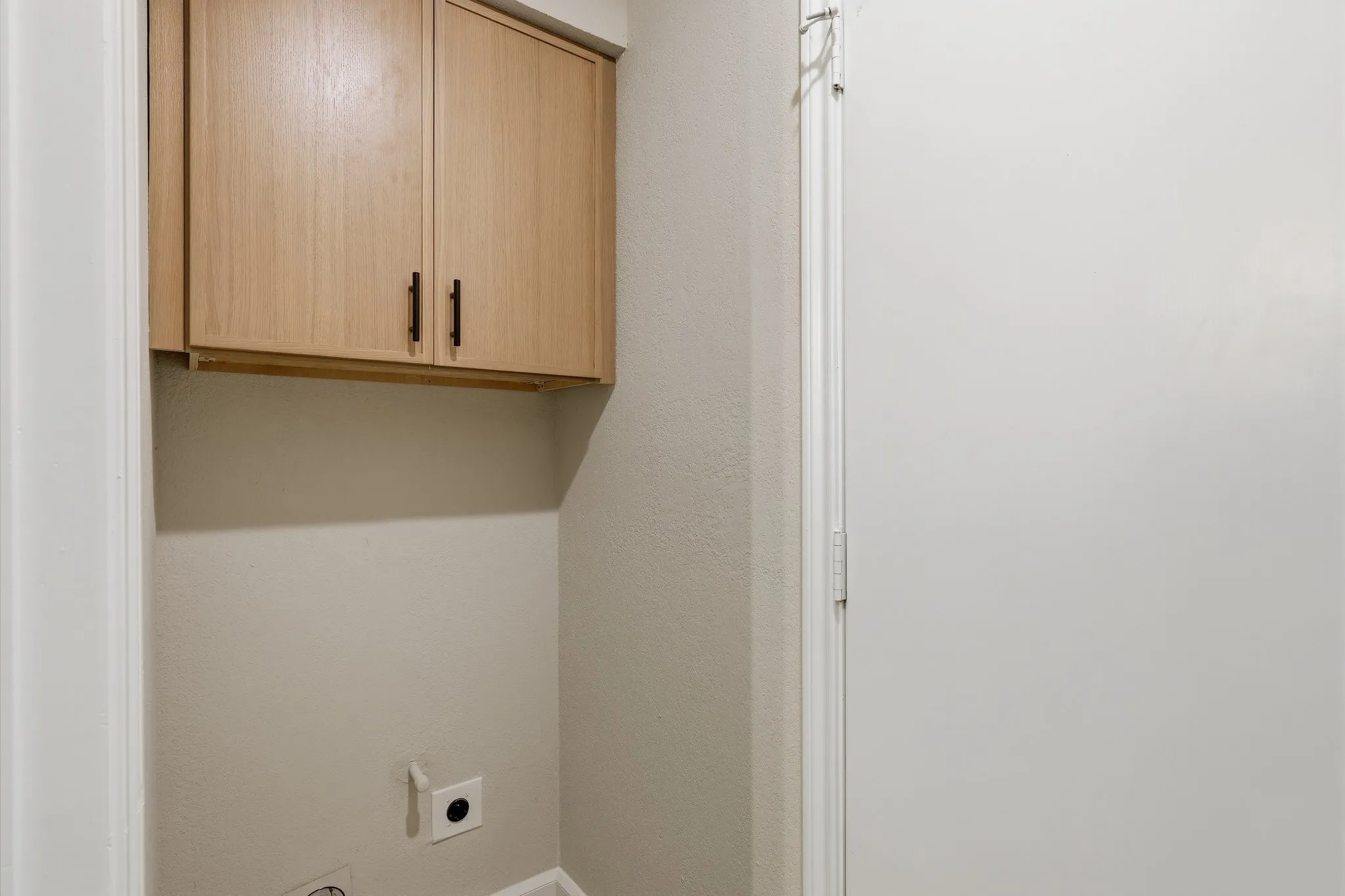 Built-in cabinetry with dark hardware