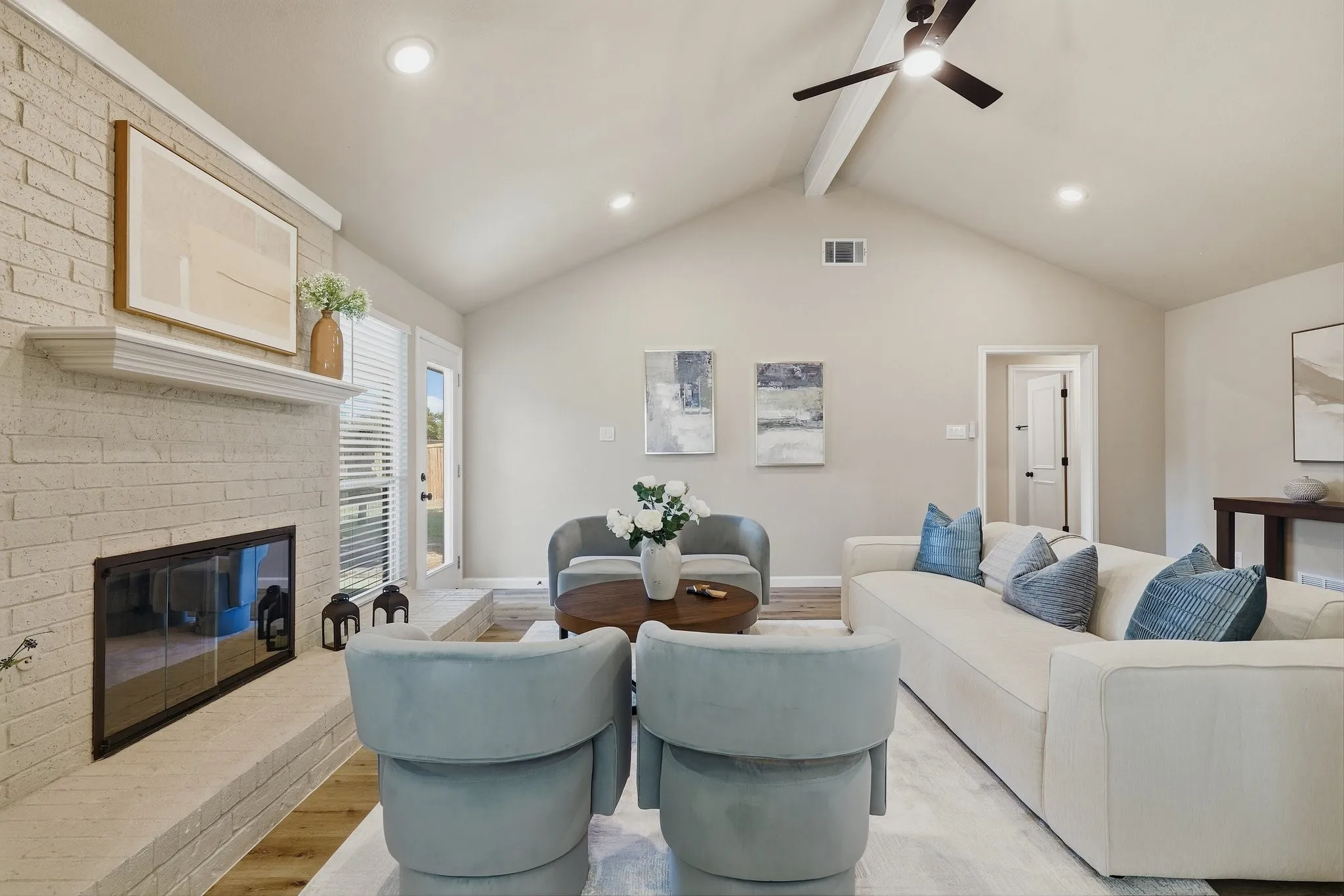 Vaulted ceiling with an exposed beam, recessed lighting, and a ceiling fan