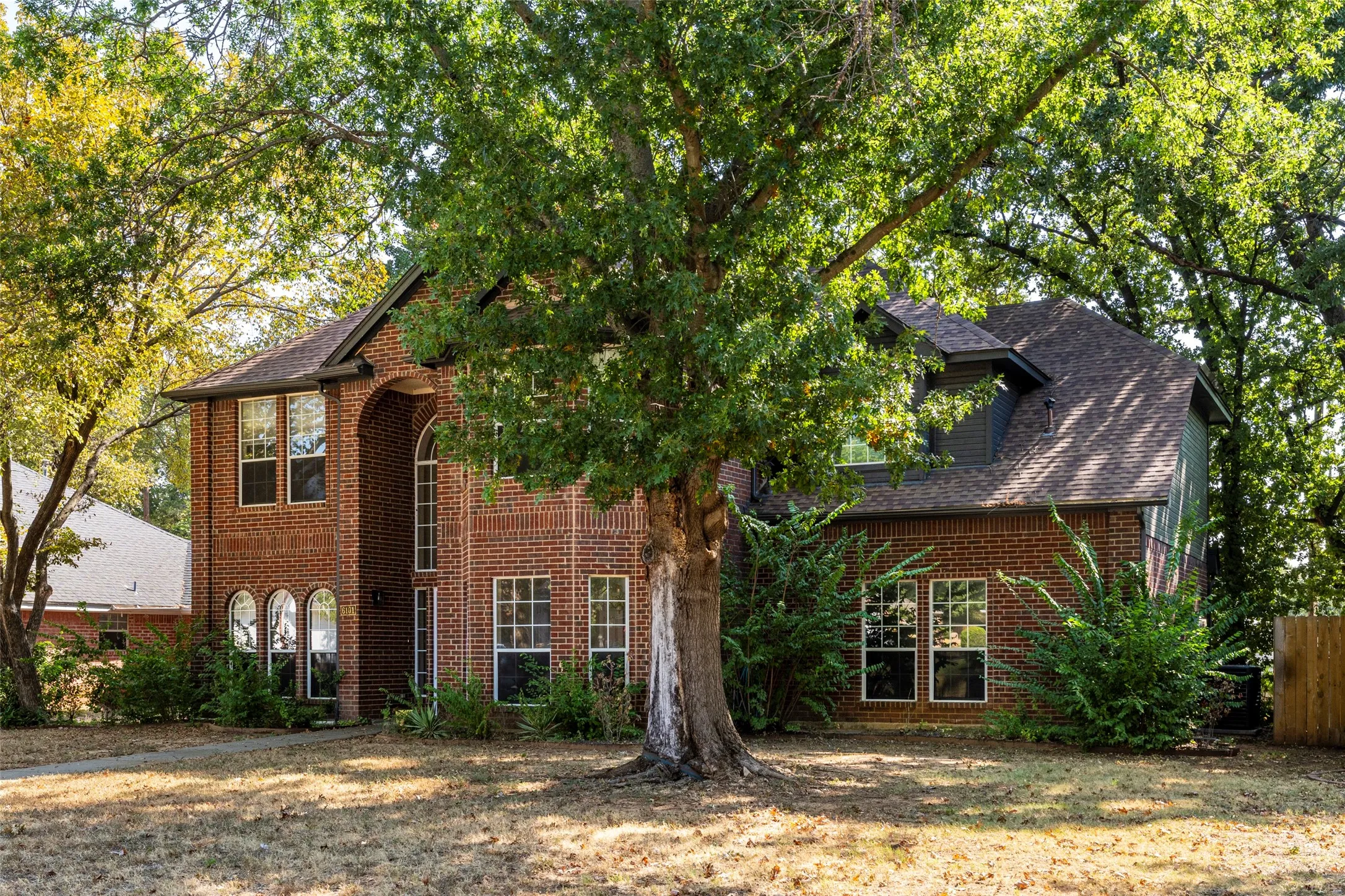 Brick exterior with an arched entry and gabled roofline