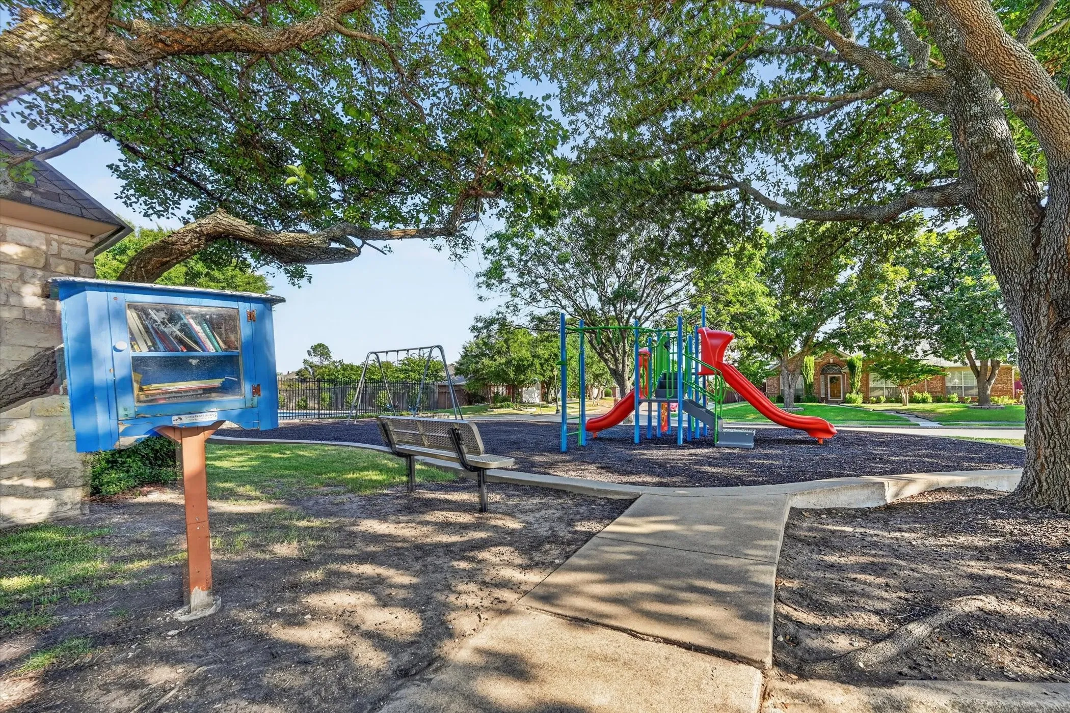 Community playground featuring slides and swings