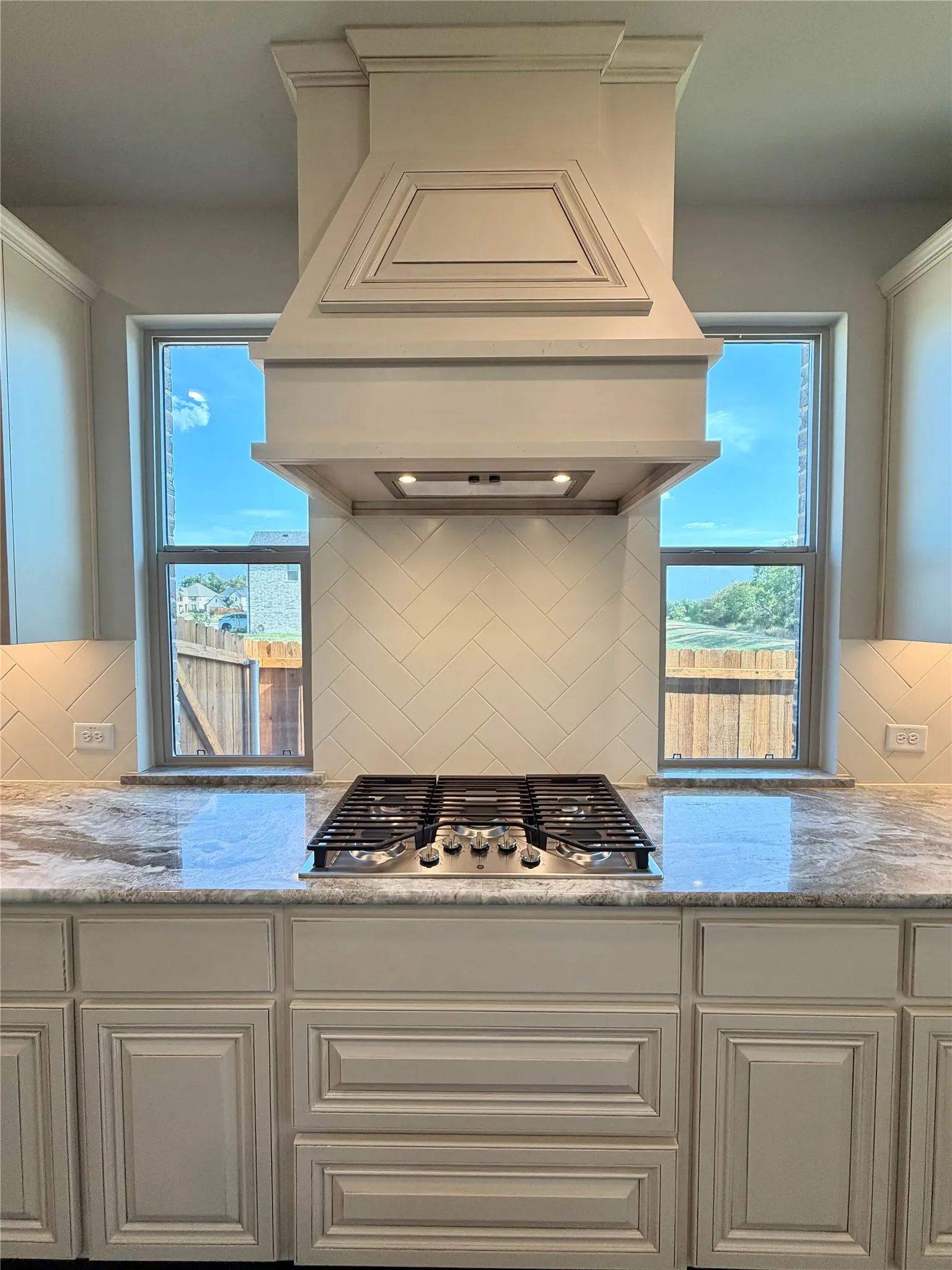 5 burner GE GAS cooktop with pot & pan drawers & custom cabinet vent hood out
