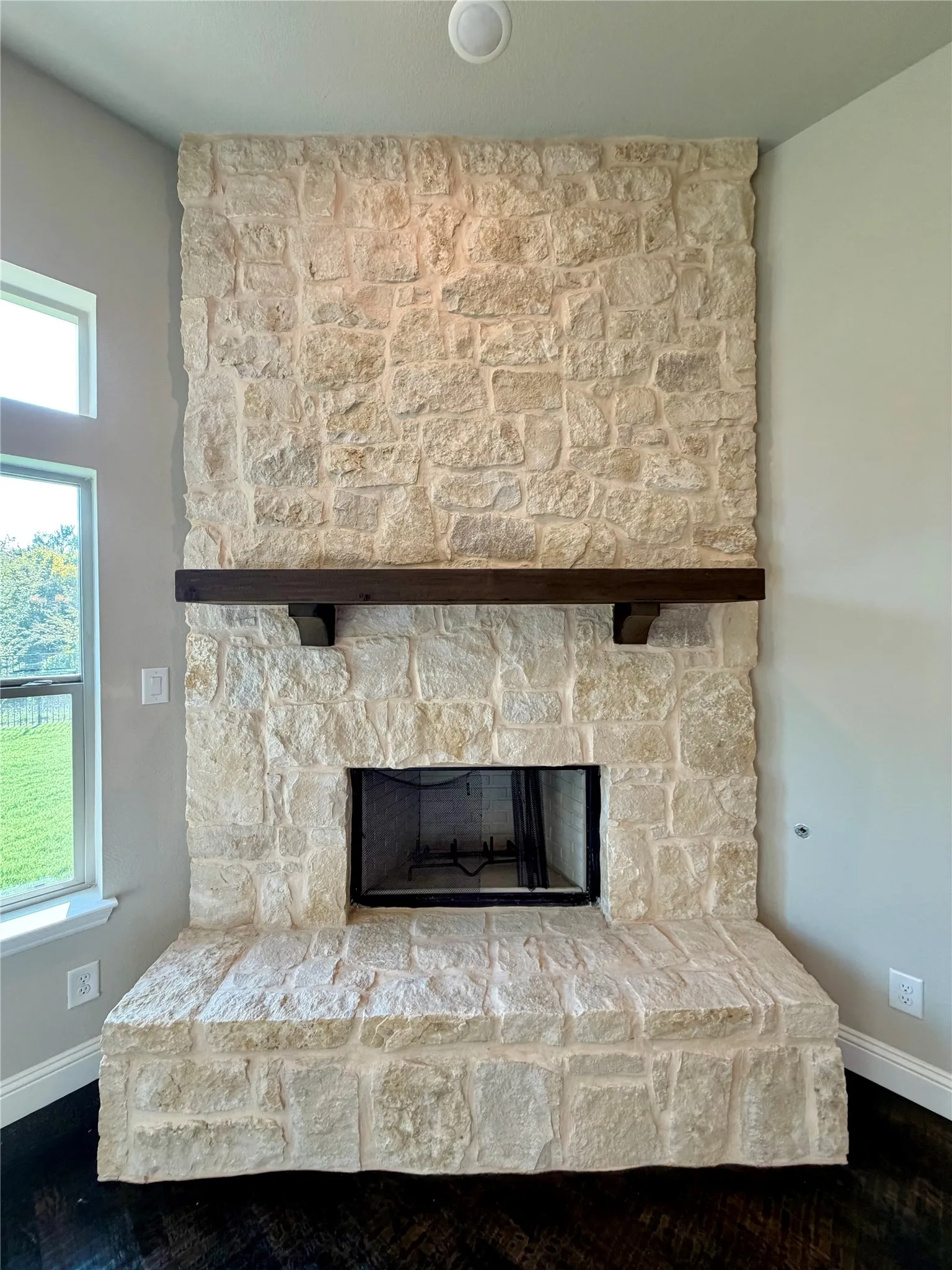 Rustic stone GAS foreplace can burn wood or gas logs with raised hearth and cedar mantle