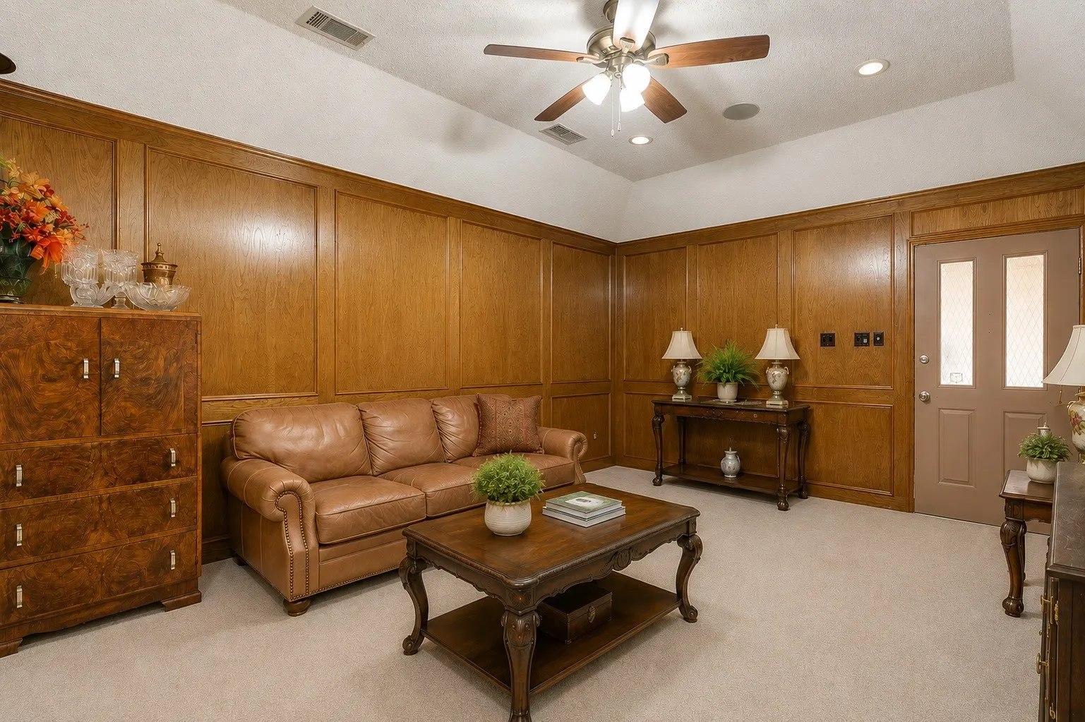 Wood paneling, tray ceiling, recessed lighting, ceiling fan, and carpeted flooring (Virtually Staged & edited)