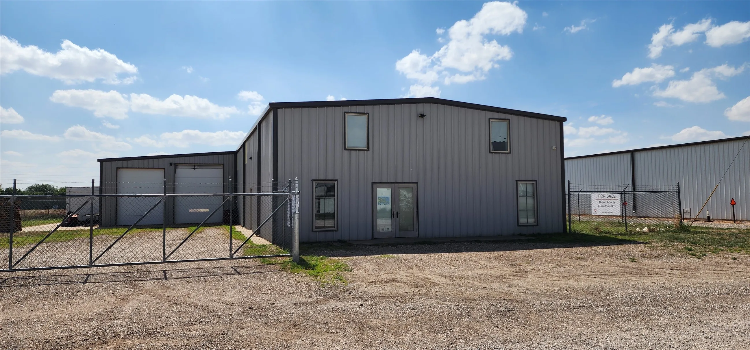 Front view of building with gated yard.