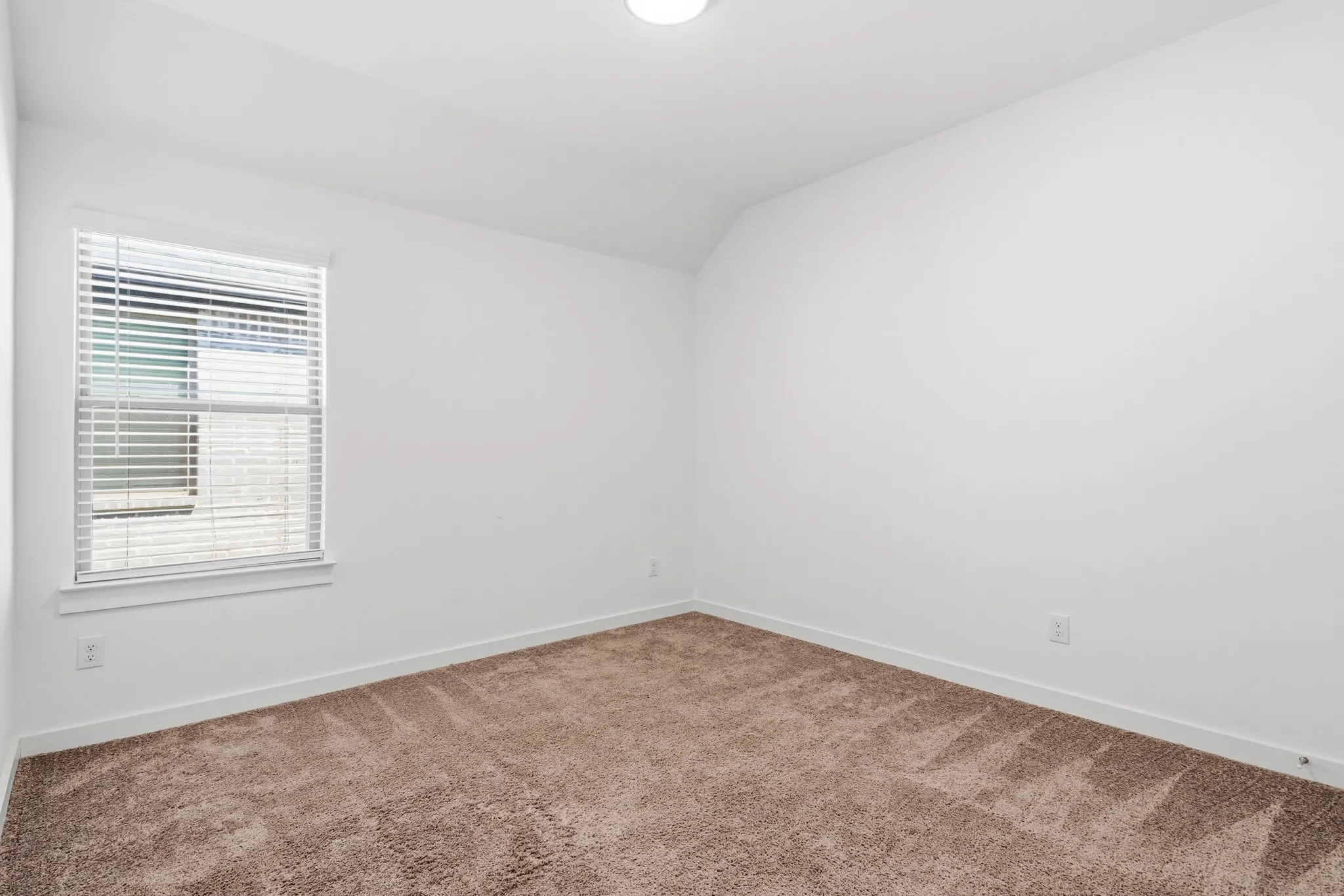 Bedroom #3 from the doorway.  All of the bedrooms have soft carpet to keep your toes comfortable when you kick of your shoes.