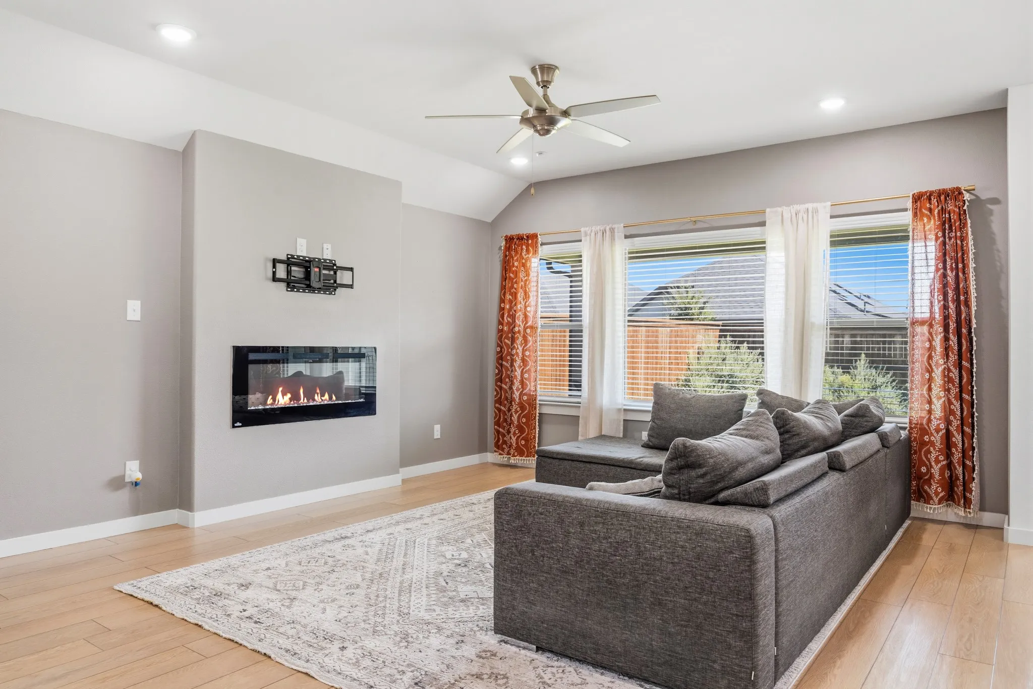 Beautiful situated living area is ideal for a comfy sectional or 5 piece set.  The area rug really pulls this space together.