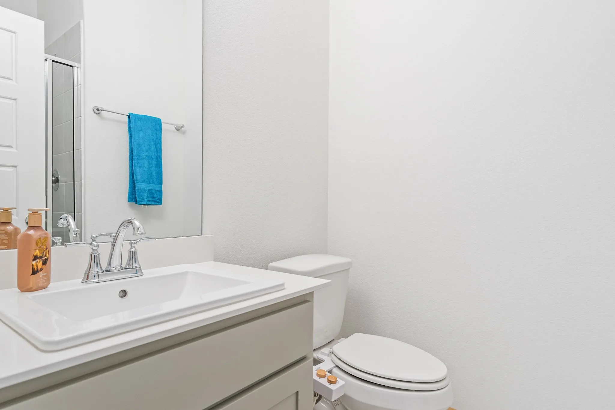 Bathroom #3 was thoughtfully placed next to the 4th bedroom. While at first glace one may think it is just a half-bath, there is a full shower purposefully placed just behind the door.