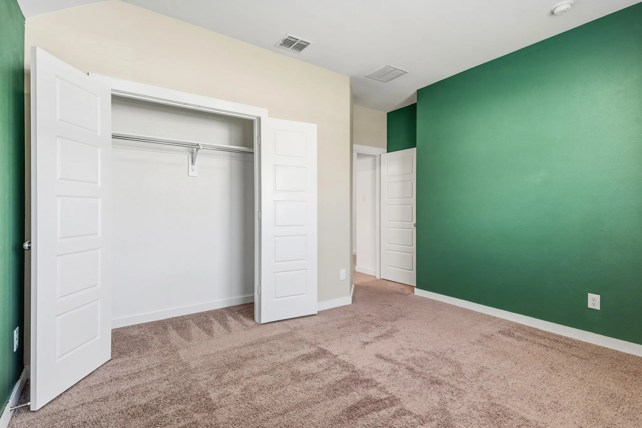 Bedroom #2 with
Evergreen walls to create the calming environment.