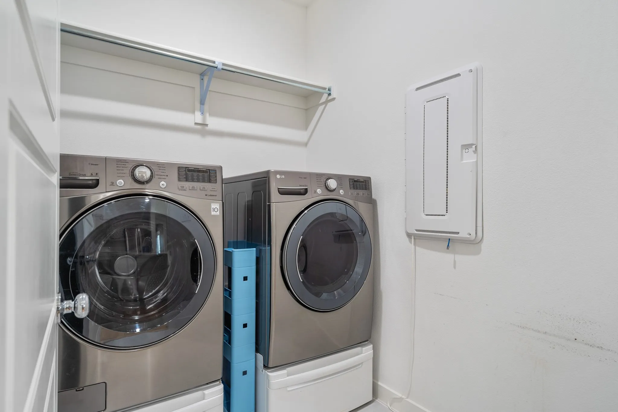 Separate laundry room is conveniently located off of the kitchen and has ample space for grand-size washer & dryer.