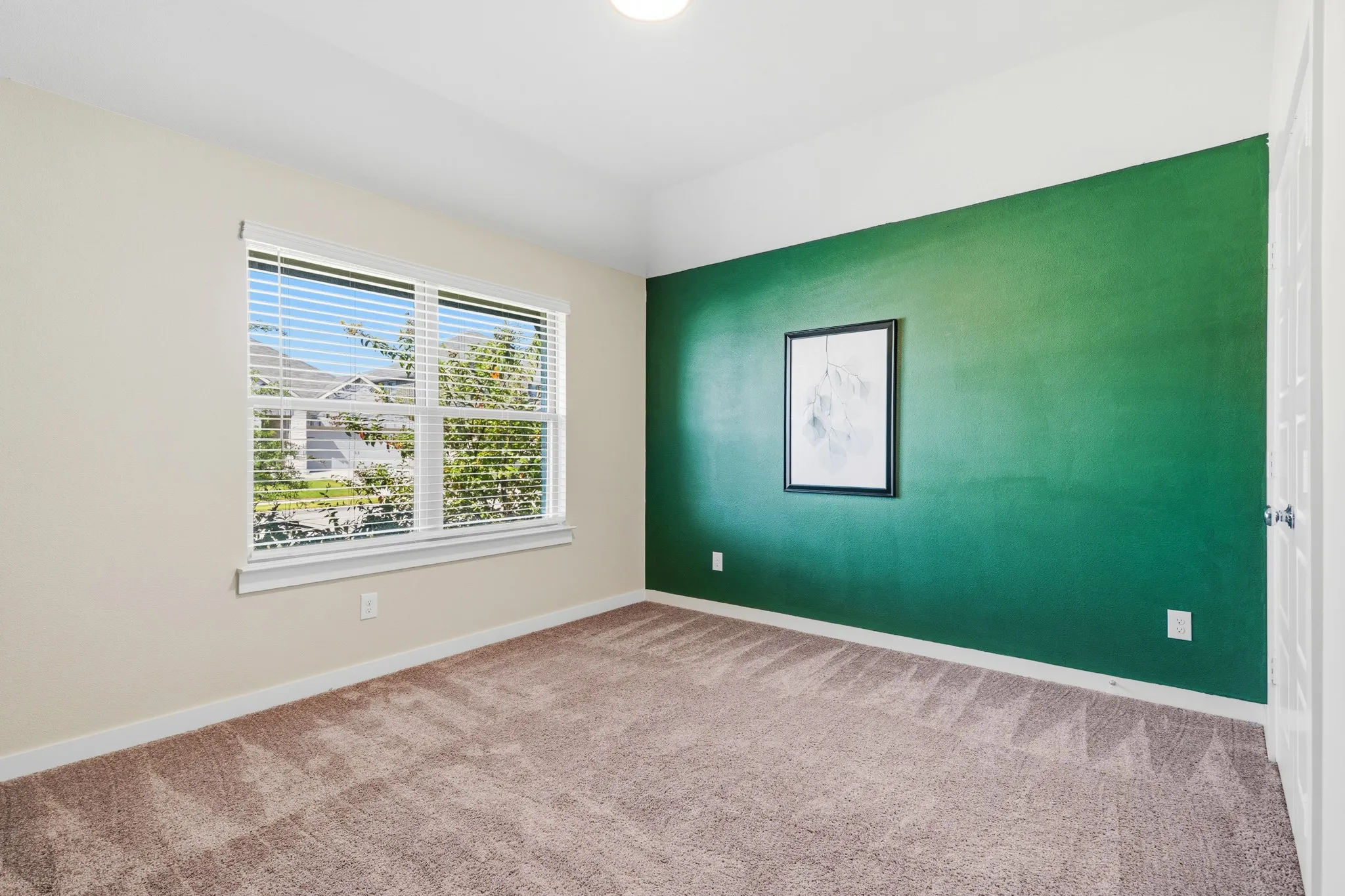 Bedroom #2 with beautiful double windows facing the front of the property.