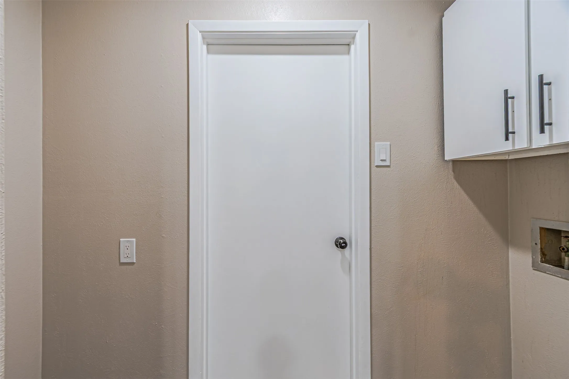 White cabinetry with black hardware