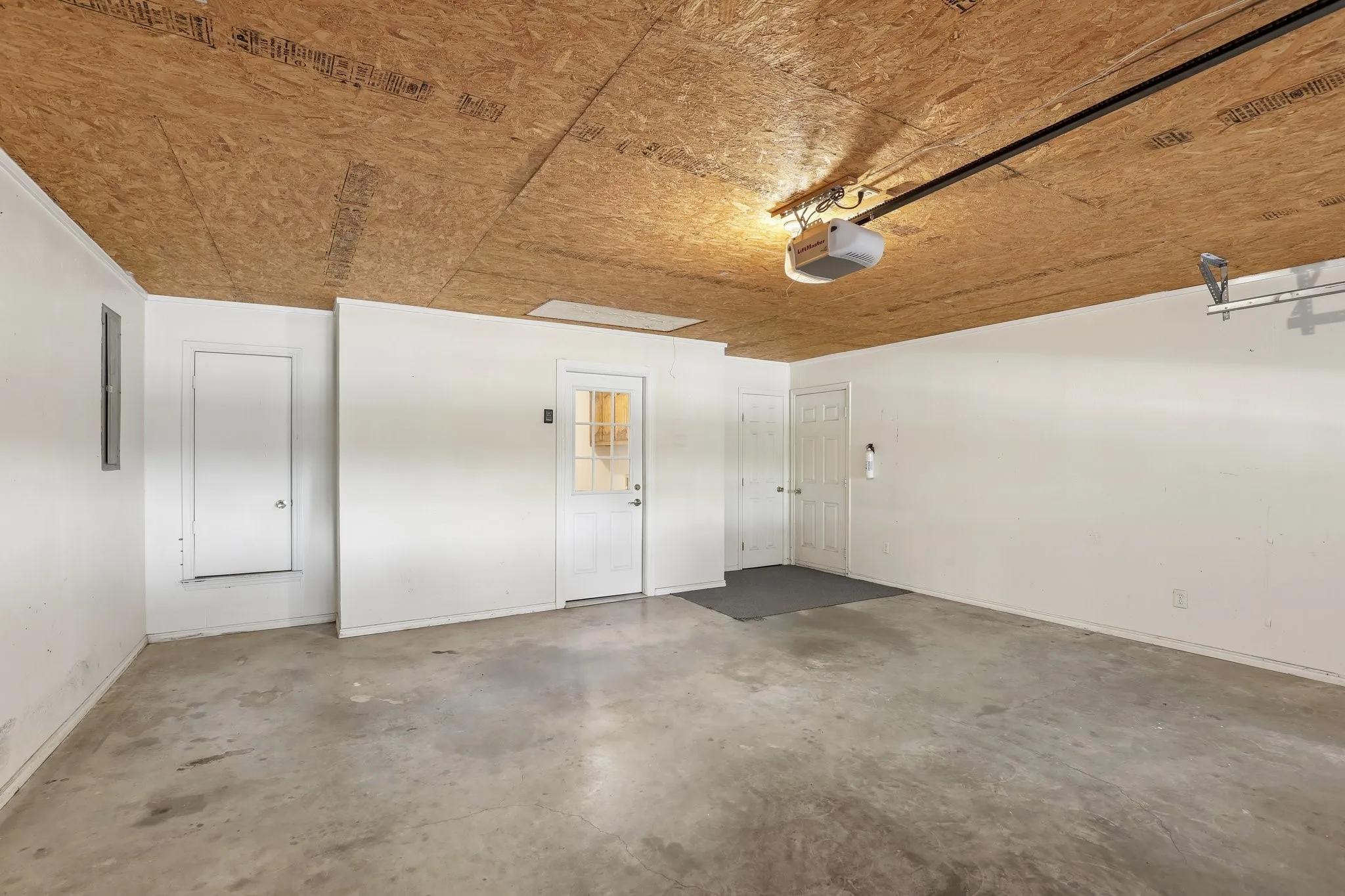 Concrete flooring and white painted walls