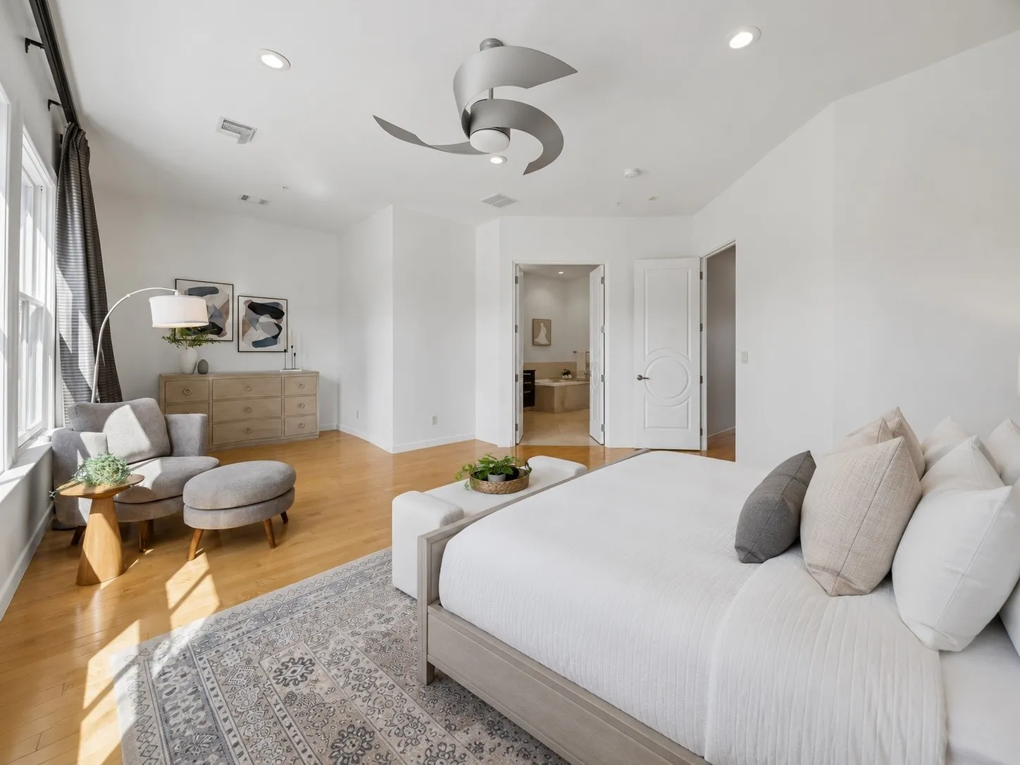 Primary Sanctuary Featuring Maple Flooring And Private Bath
