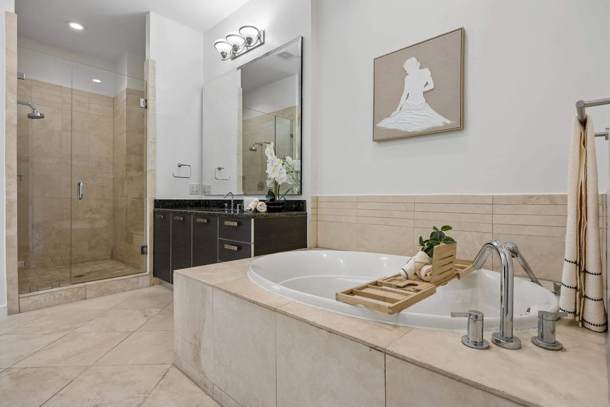 Spa-Like Shower Featuring Frameless Glass Enclosure with Bench