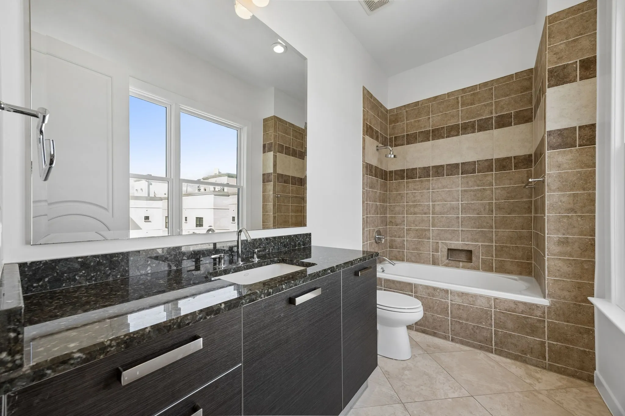 Full Bath With Black Granite Counters And Biefbi Italian Cabinetry