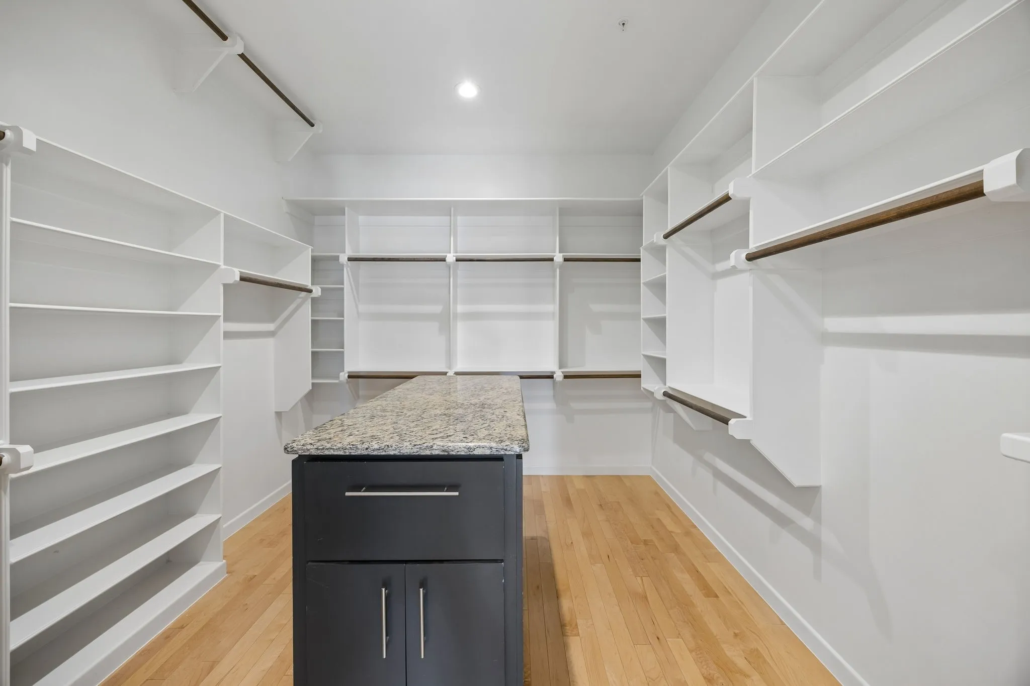 Oversized Walk-In Closet With Center Island And Organization System