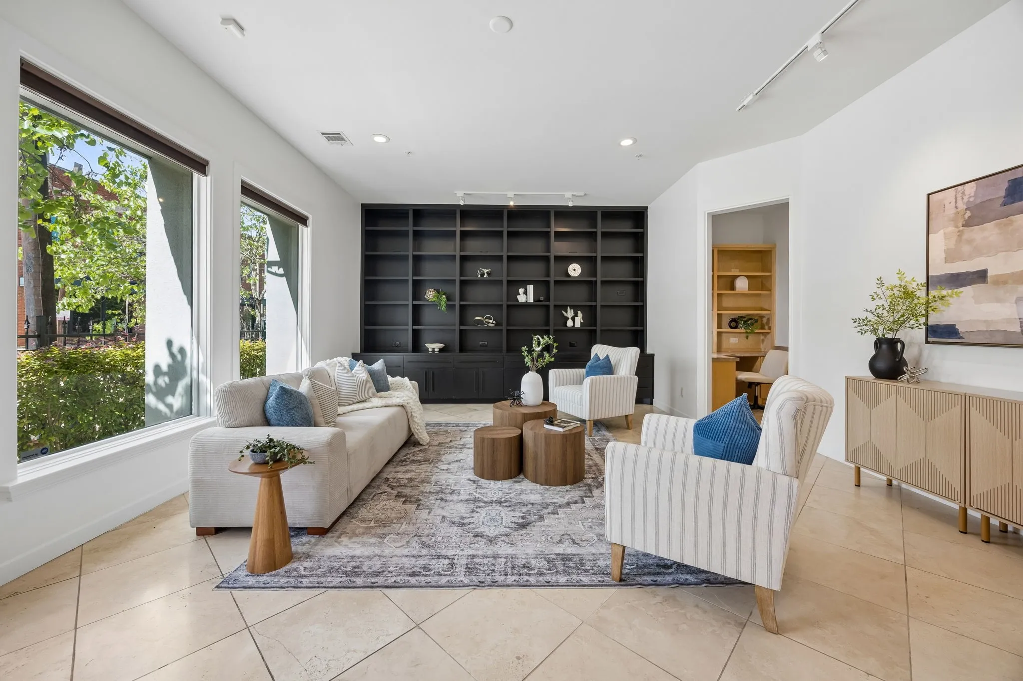 First Floor Living with Extensive Floor-To-Ceiling Storage And Display Cabinetry