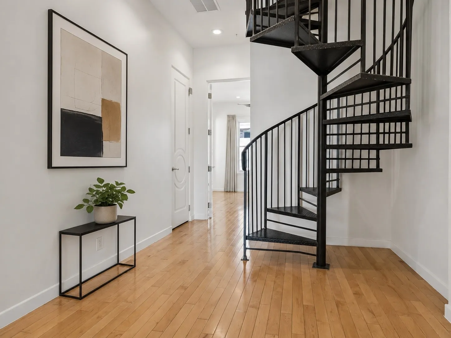 Dramatic Iron Spiral Staircase Leading To Rooftop Deck