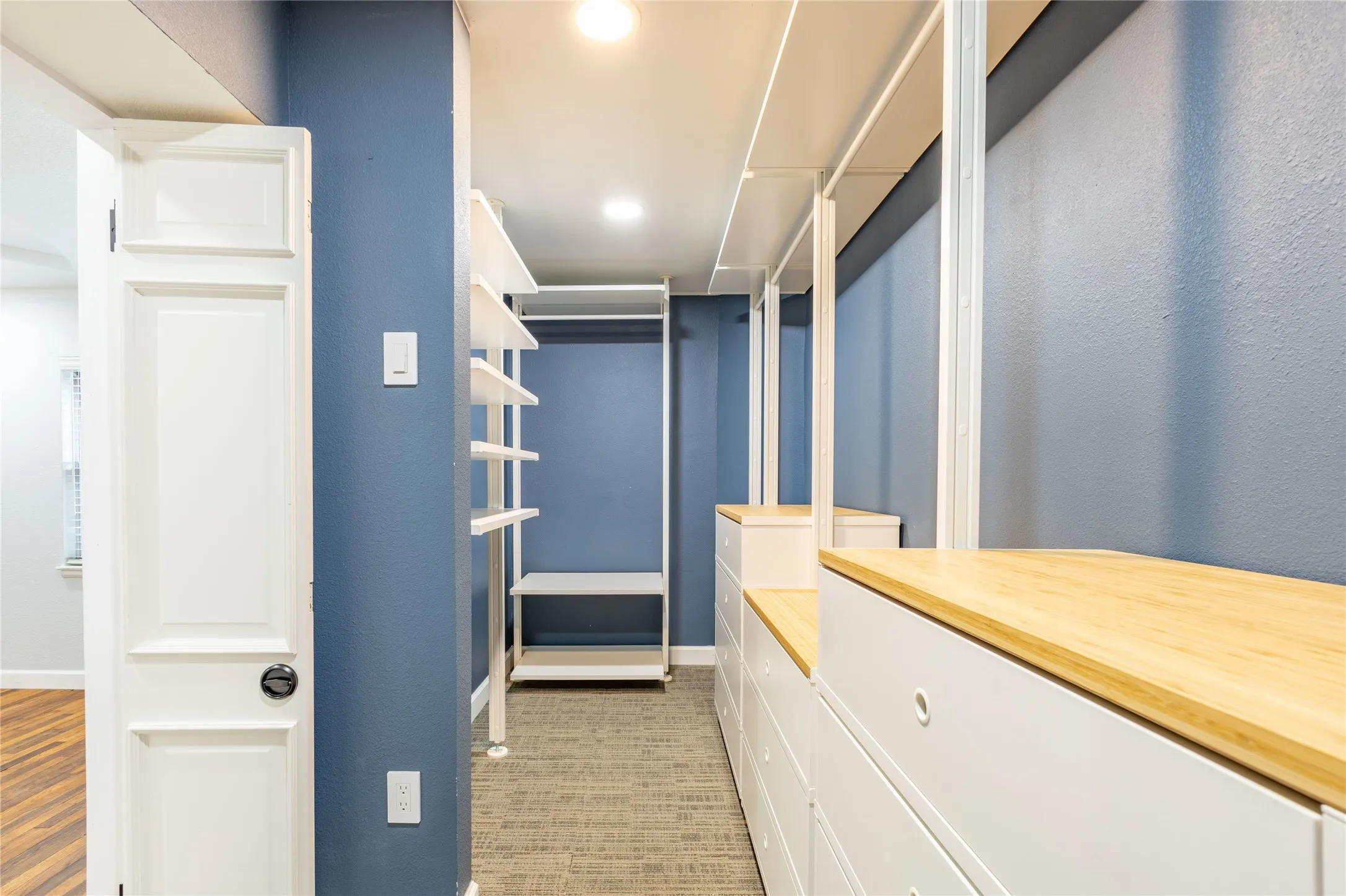 Custom closet system in primary bedroom