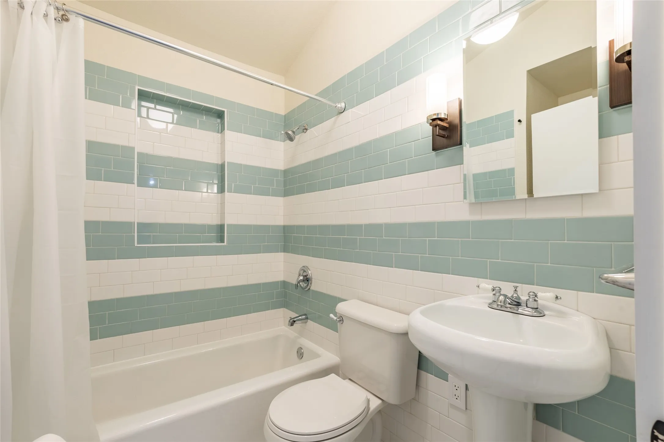Full bath is pretty and there is extra storage space on the other side.