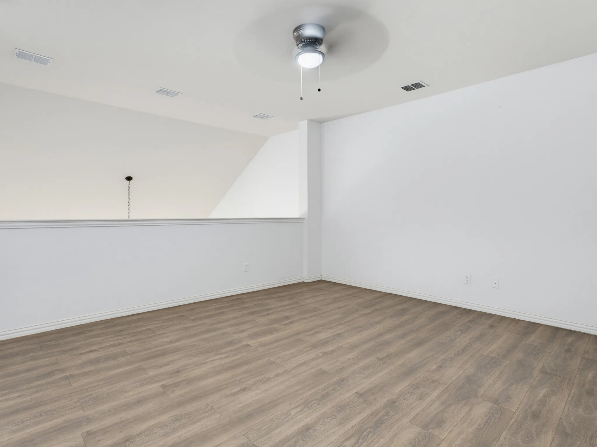 Wood-finish flooring with white walls