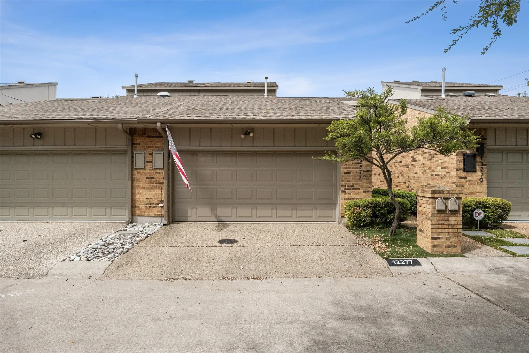 Front of property with 2 car garage.