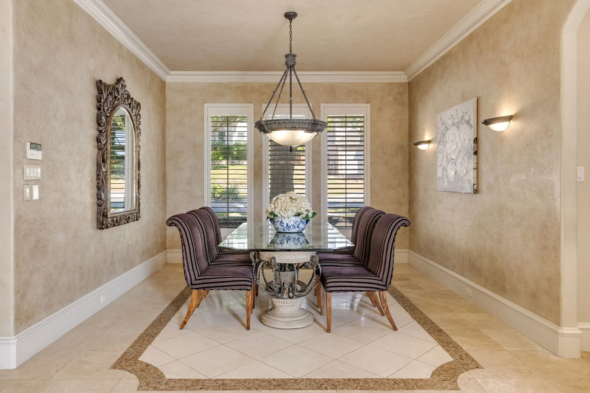 Formal dining room overlooking the front of the home with plantation shutters.