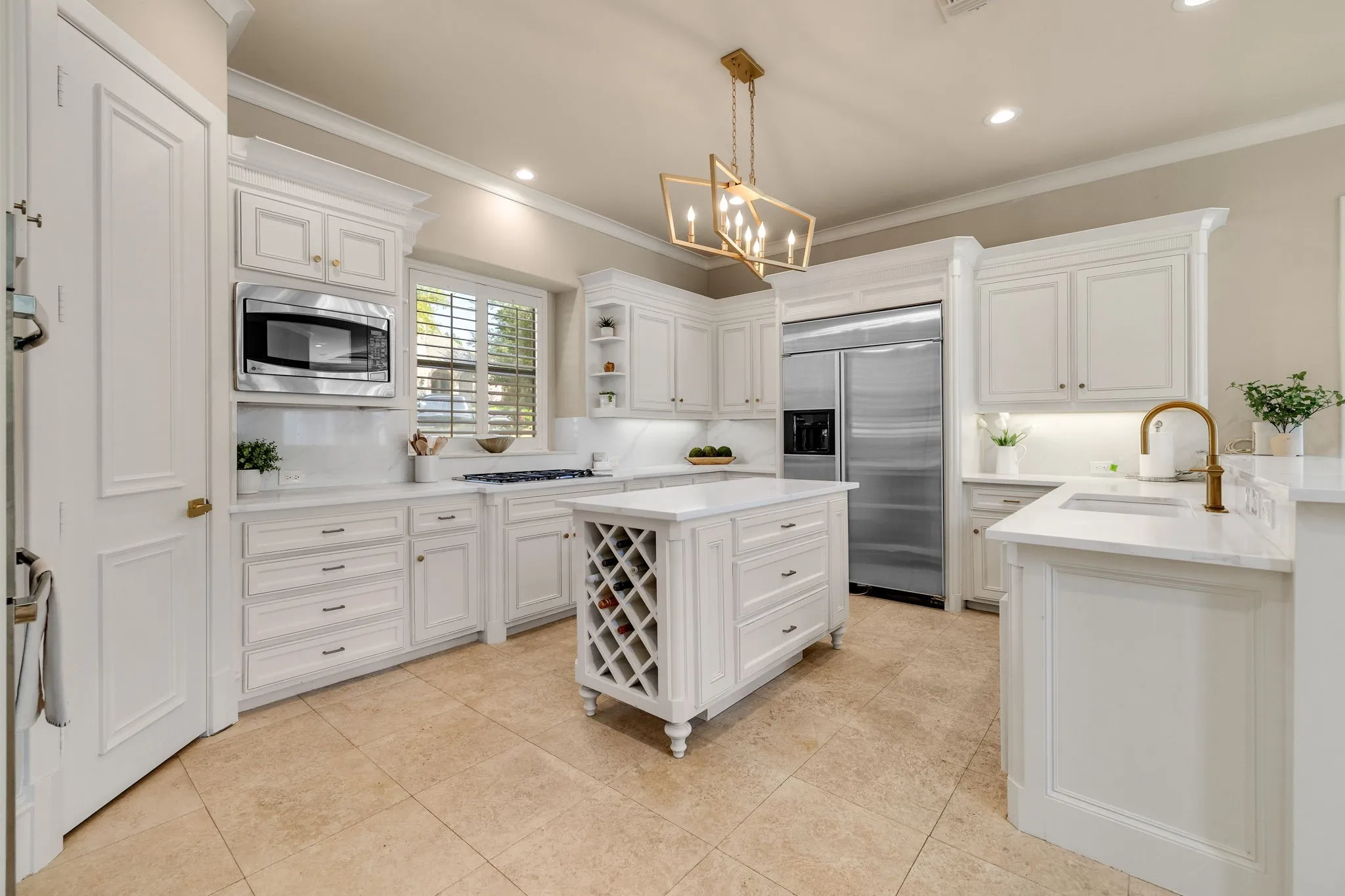 Gourmet kitchen with pristine white cabinetry.