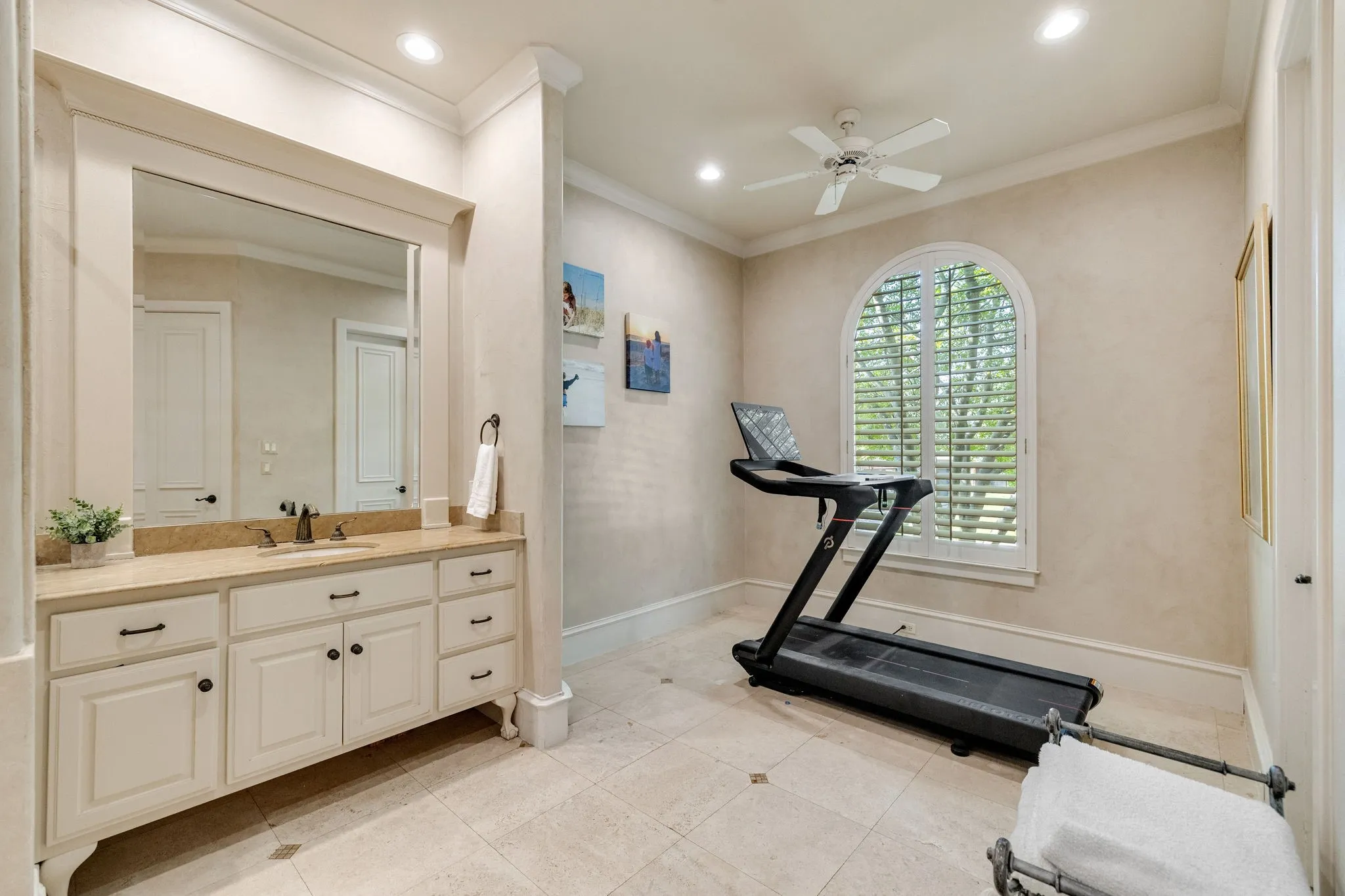 En-suite bath features bonus area, great for exercise room with ceiling fan.
