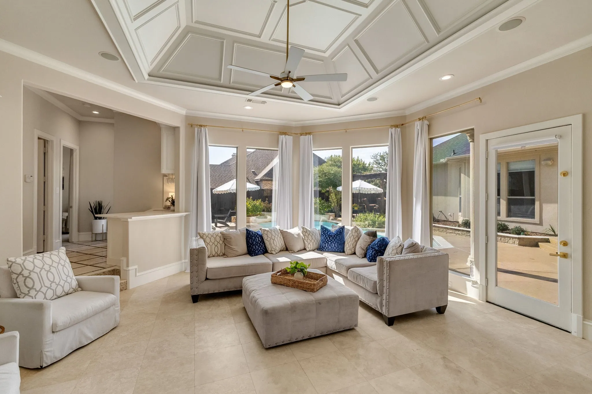 Grand living room overlooking the backyard oasis.