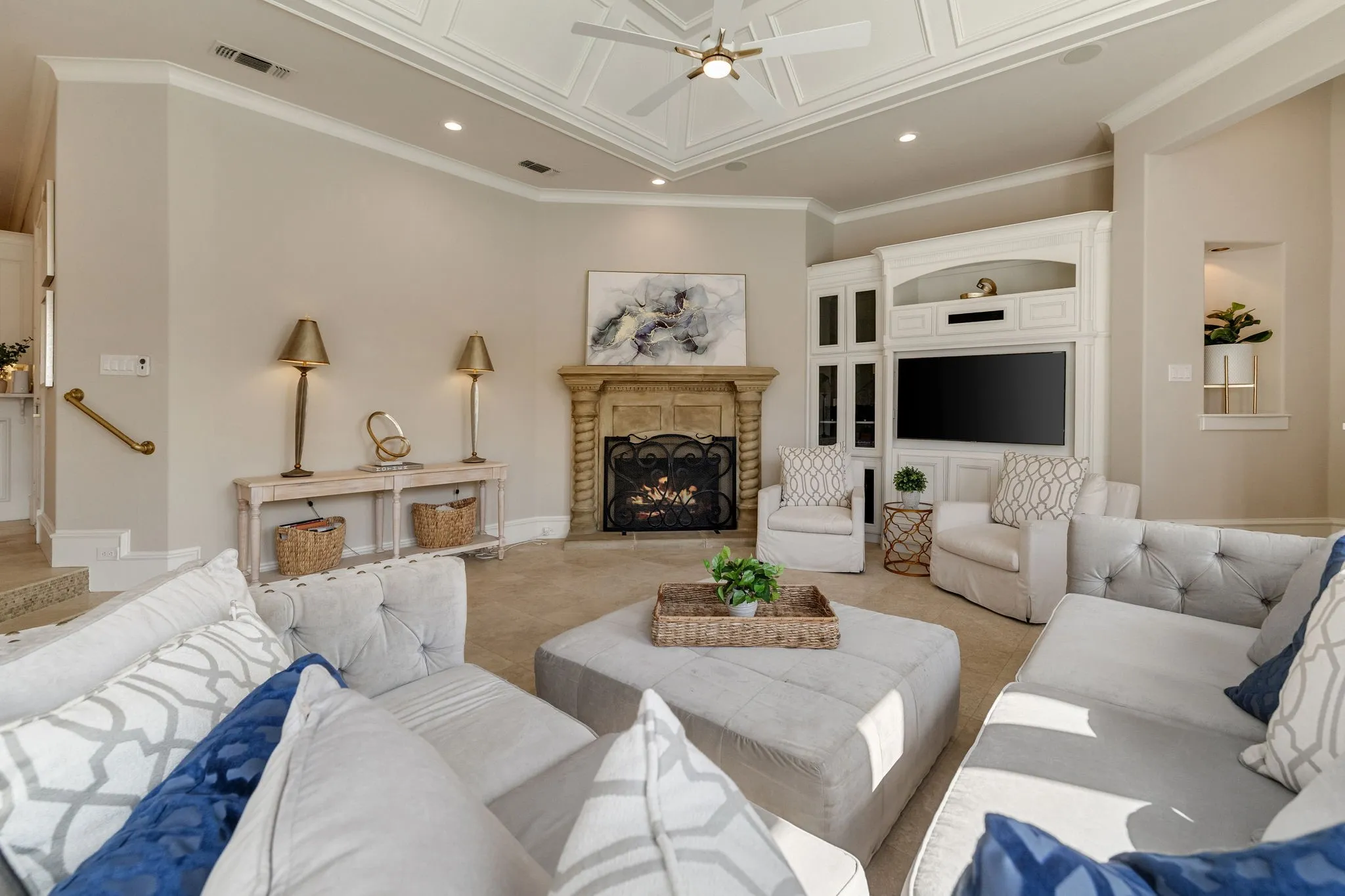 Living room with built-ins, and cozy fireplace.