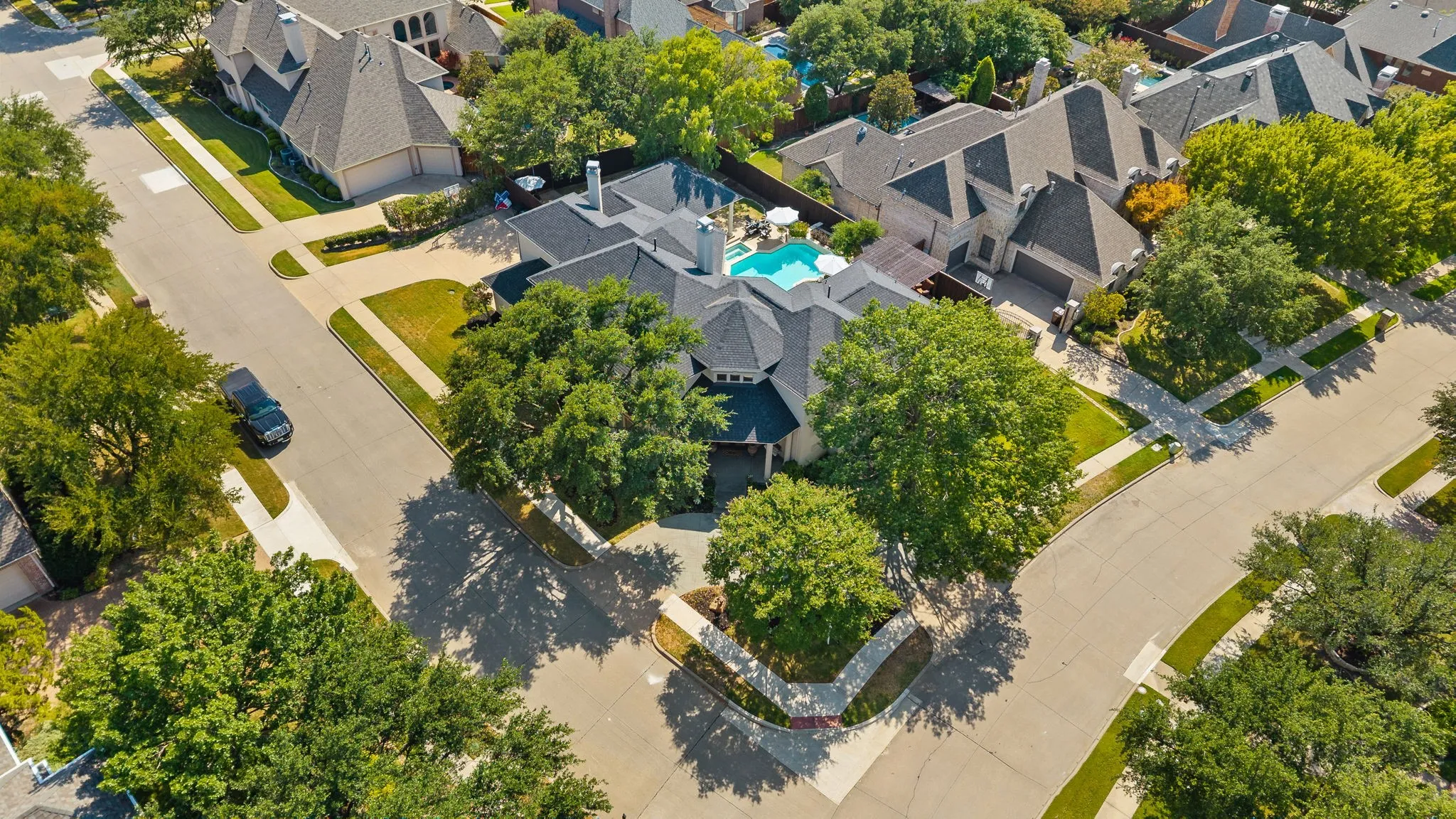Aerial view of home showcasing corner lot.